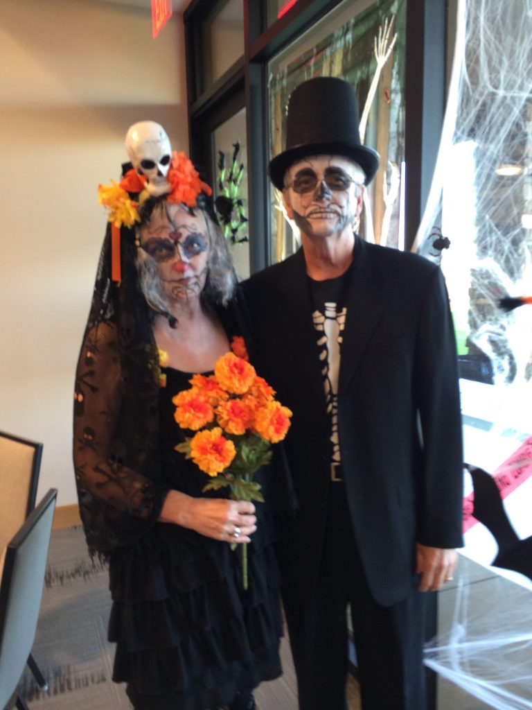 Couple dressed in Day of the Dead Costumes.