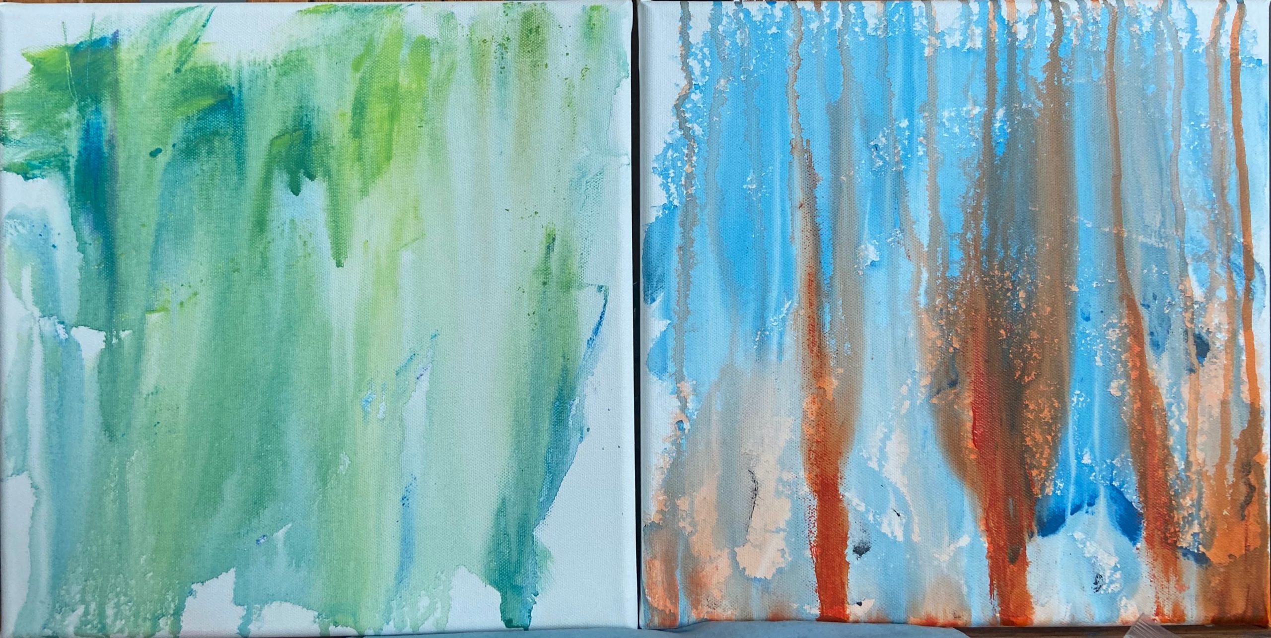 Two canvases dripped with leftover paint