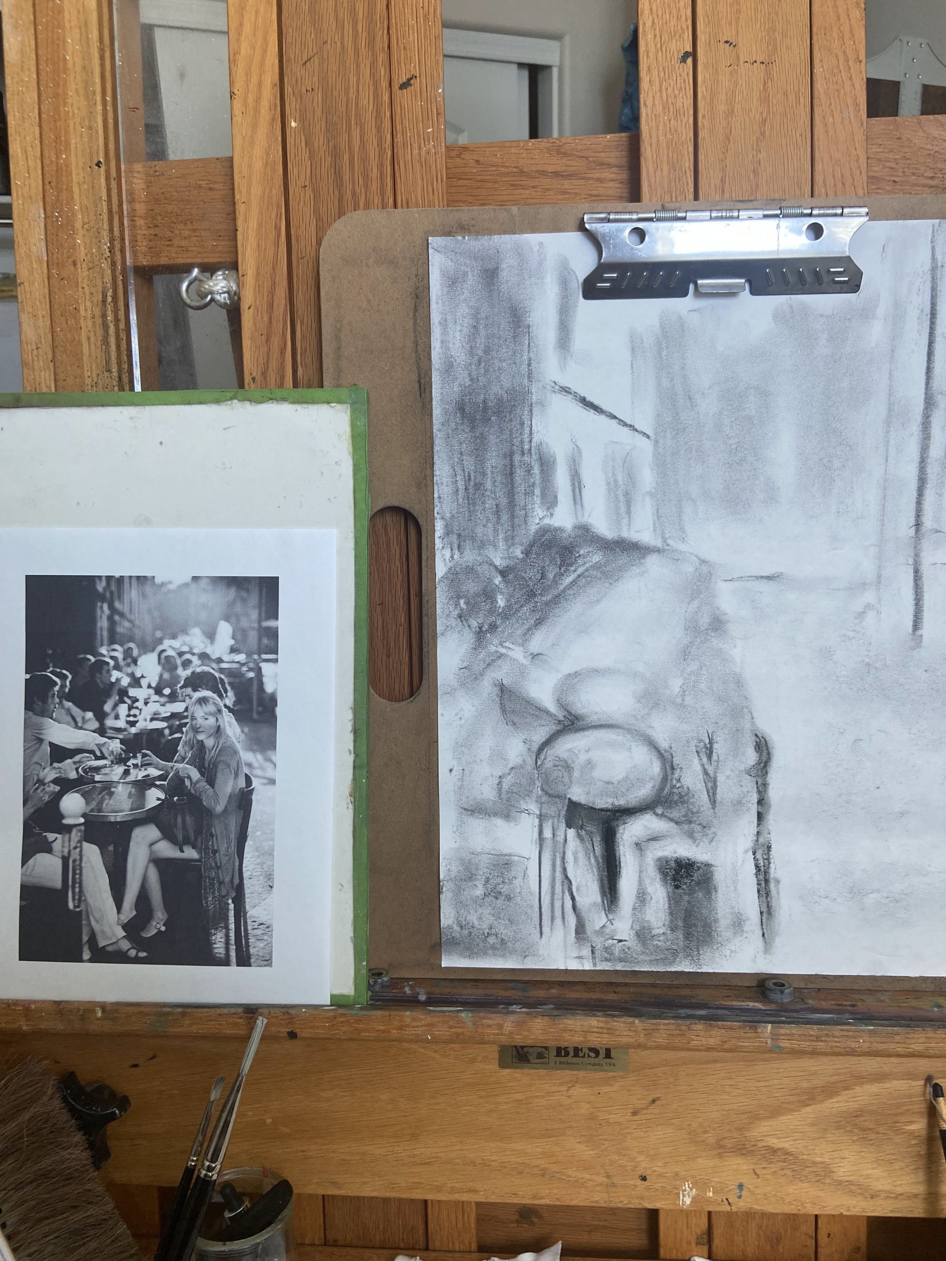 Initial blocking in of a charcoal draawing of a crowd of people