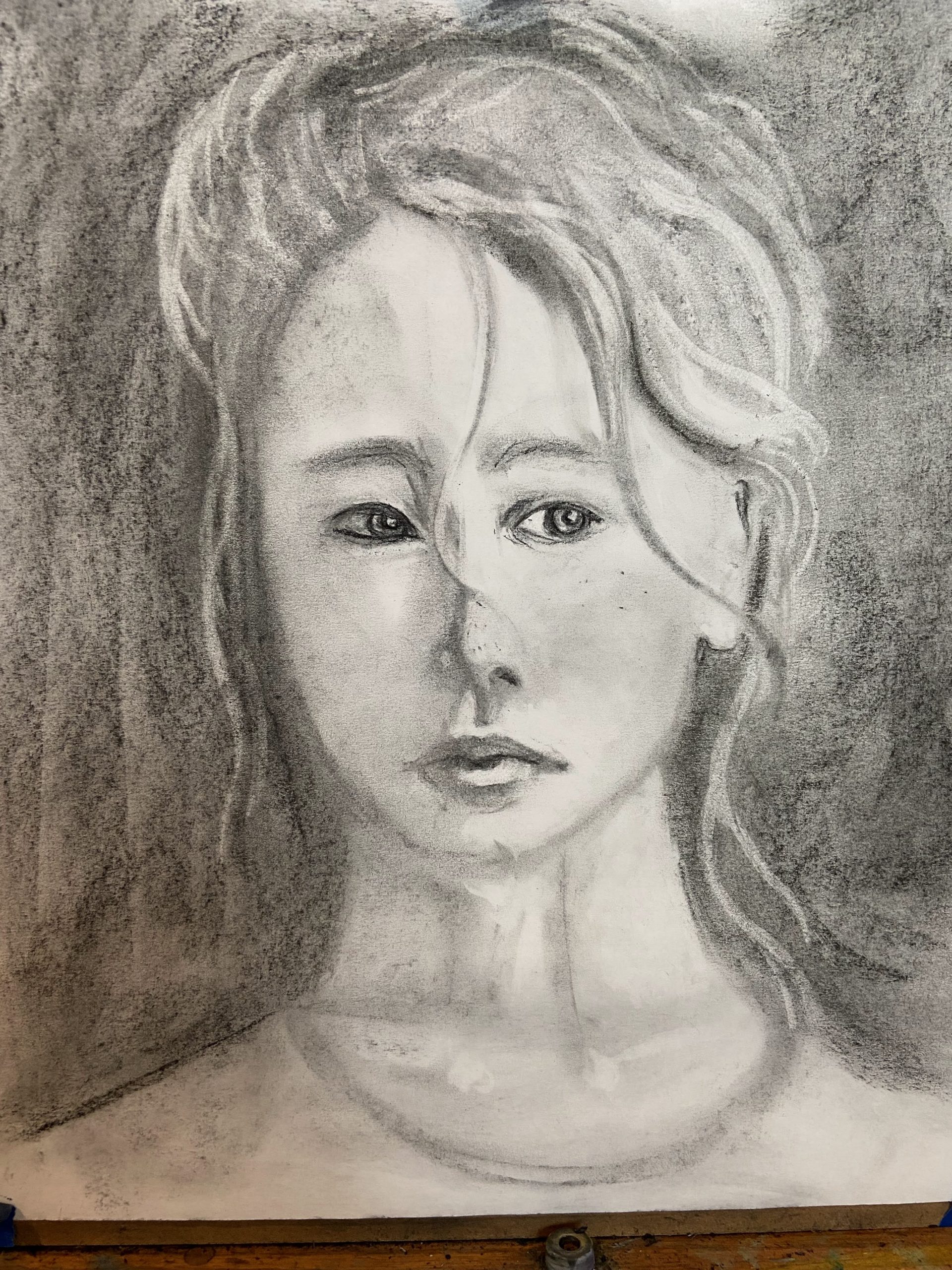 Charcoal portrait of a young woman
