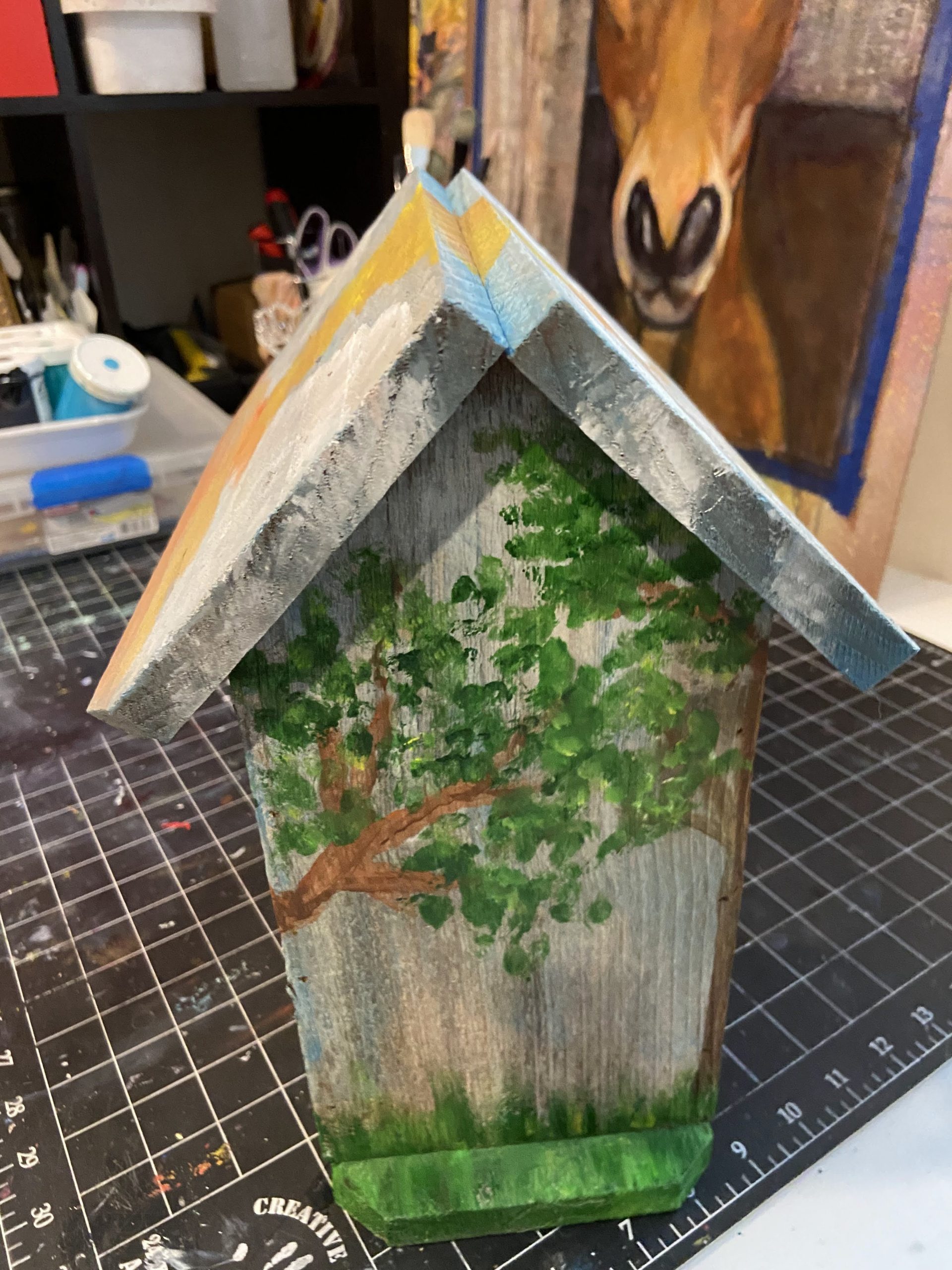 Back view of a rustic birdhouse