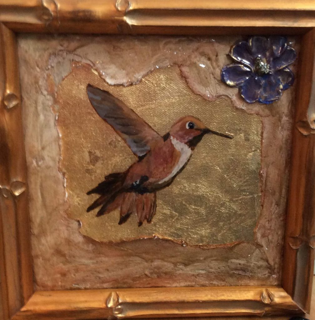 Painting of a Rufous Hummingbird painted on gold leaf. 