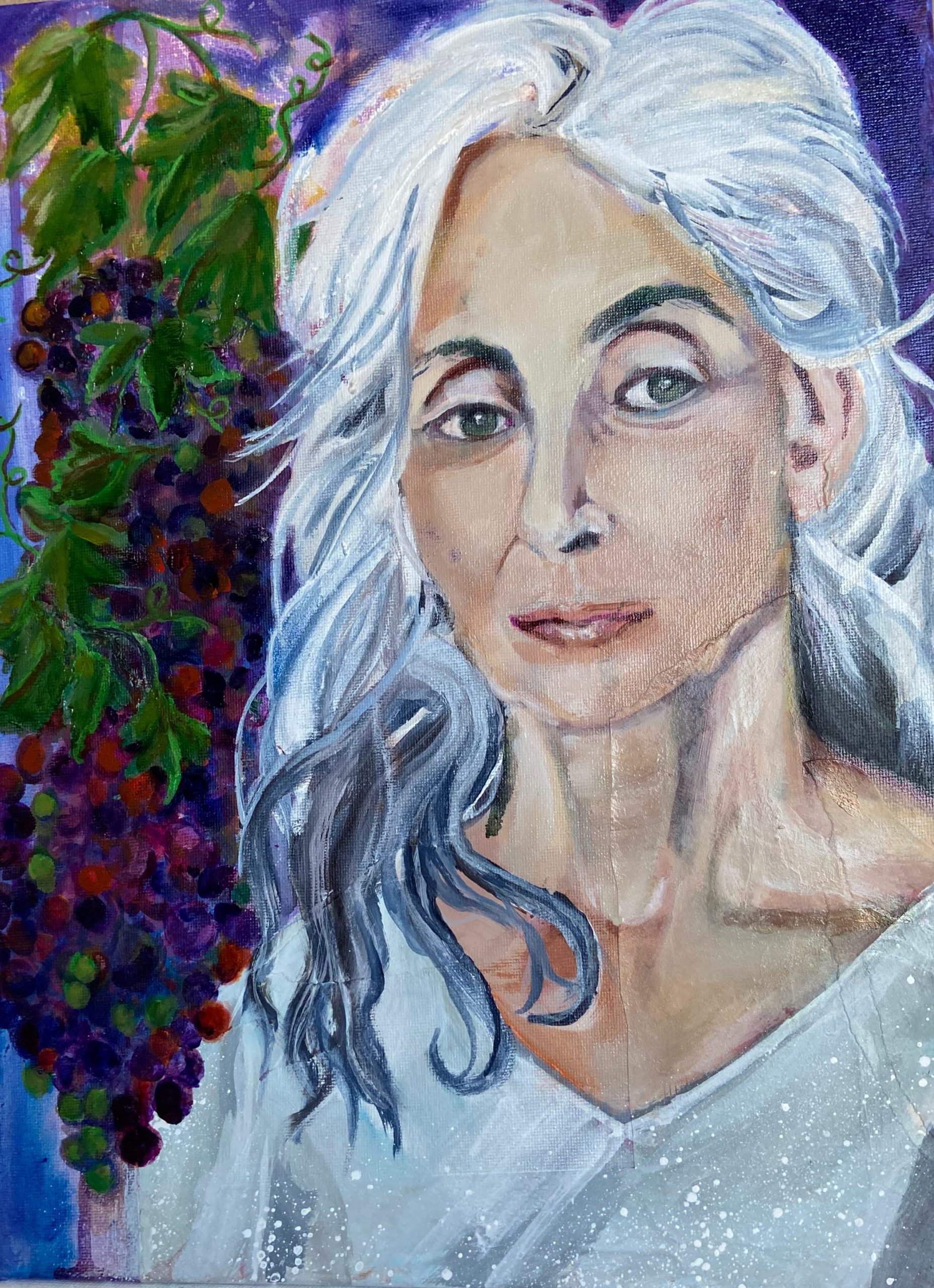 Final portrait of a mature woman with grapes
